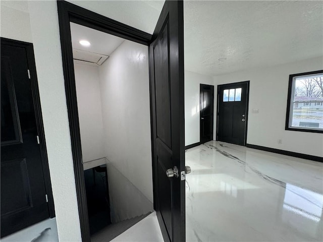 foyer featuring a textured ceiling