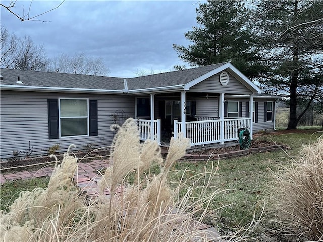 single story home with covered porch