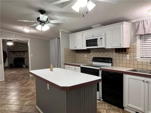 kitchen with white cabinets, white appliances, a fireplace, and ornamental molding