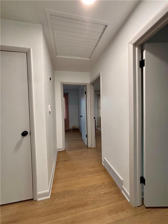 corridor featuring light hardwood / wood-style floors