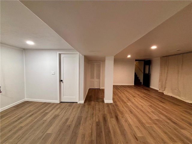 basement featuring hardwood / wood-style floors