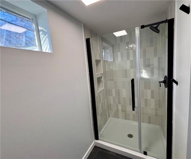 bathroom with tile patterned flooring and an enclosed shower