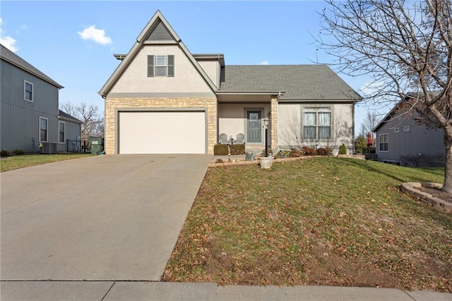 view of front of property featuring a garage and a front yard