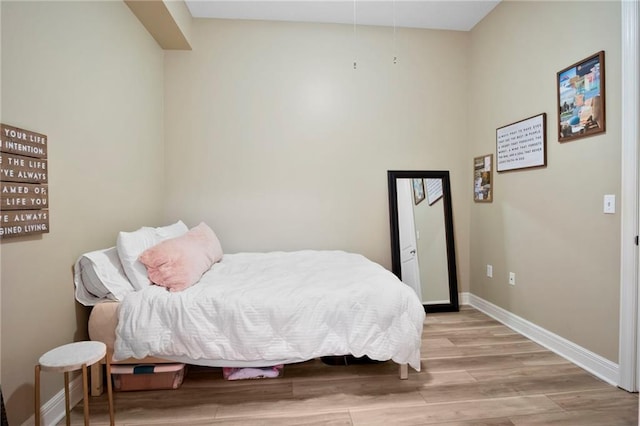 bedroom with light hardwood / wood-style floors