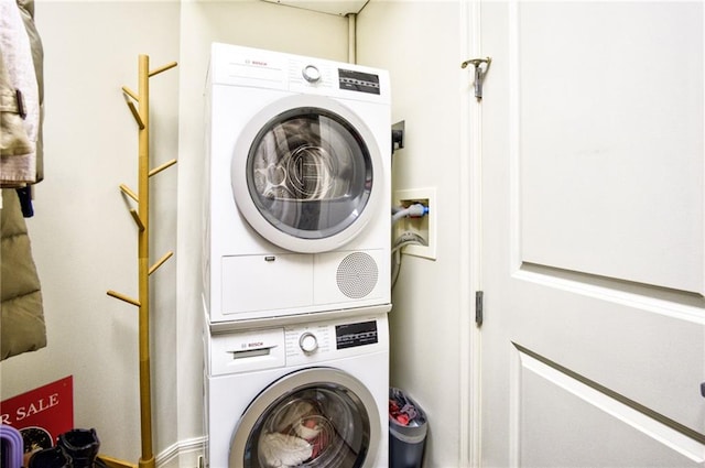 laundry area featuring stacked washing maching and dryer