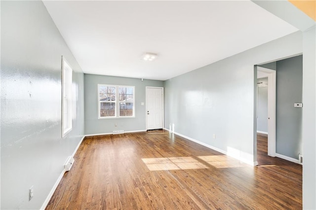 spare room with wood-type flooring