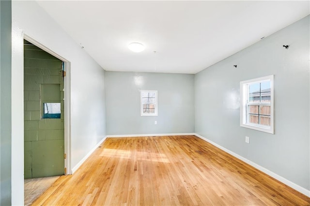 unfurnished room featuring hardwood / wood-style floors