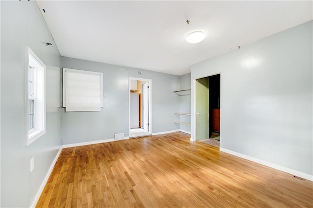 unfurnished room featuring light hardwood / wood-style floors