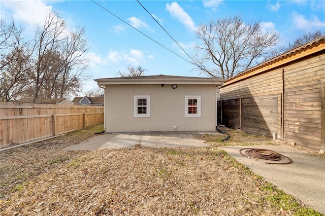 rear view of property featuring a patio