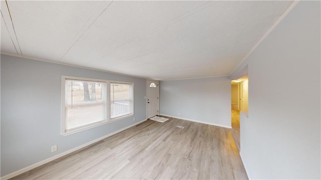 unfurnished room featuring light wood-type flooring