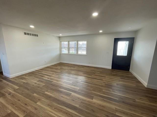 foyer featuring dark wood-type flooring