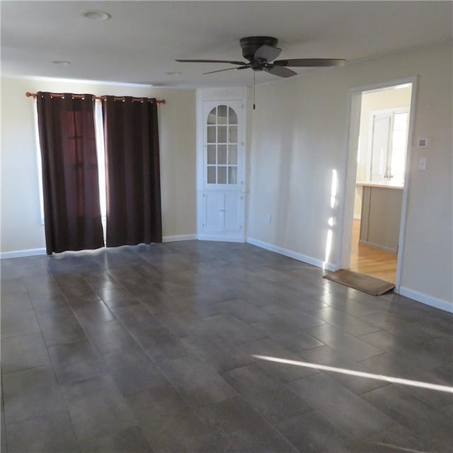 spare room featuring ceiling fan