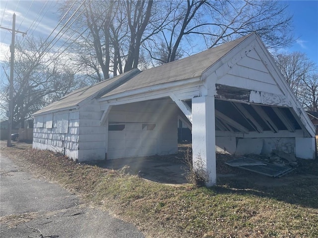 view of side of property with a carport