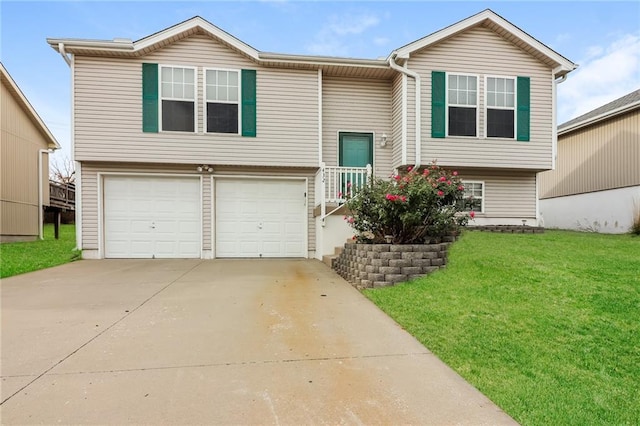 split foyer home with a front lawn and a garage