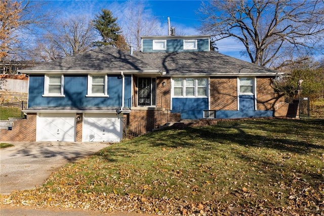 view of front property with a garage and a front yard