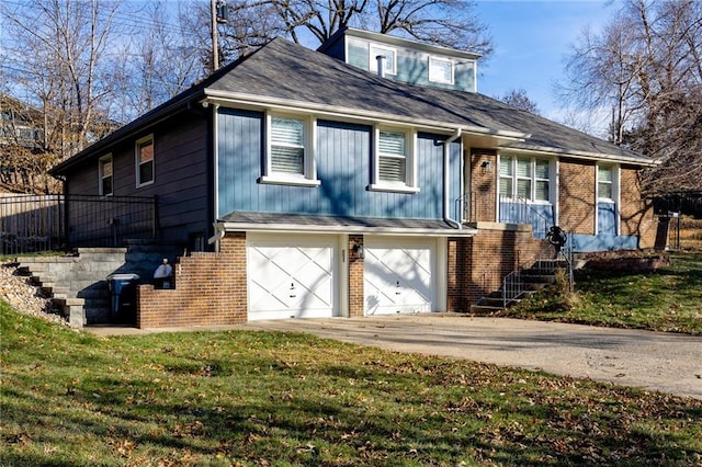 view of property with a front yard and a garage