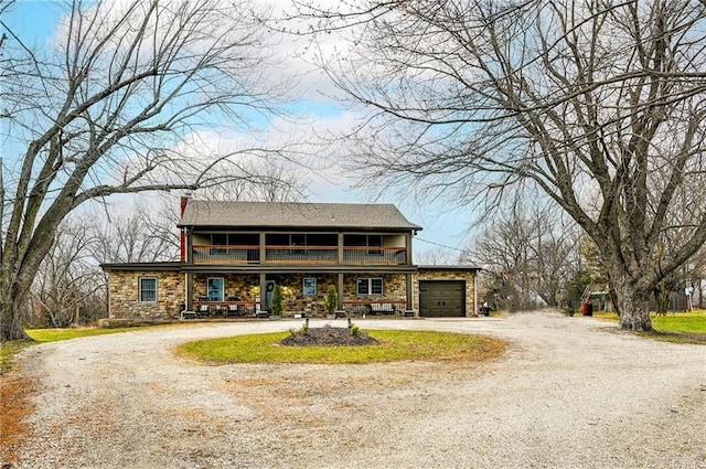 view of front of house with a porch and a garage