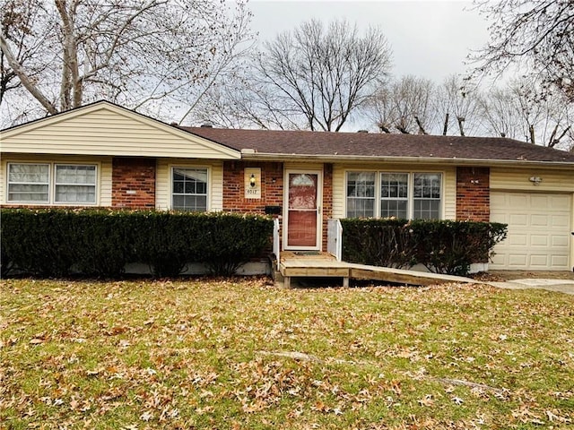 single story home with a garage and a front lawn