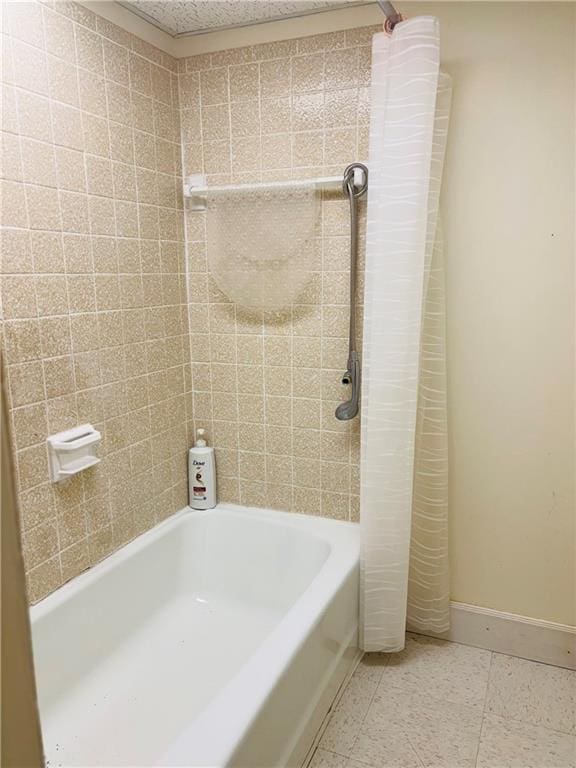 bathroom featuring shower / tub combo with curtain