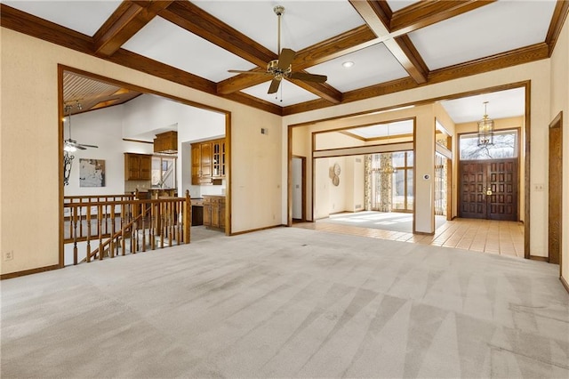 unfurnished living room featuring ceiling fan with notable chandelier, coffered ceiling, light carpet, and beam ceiling