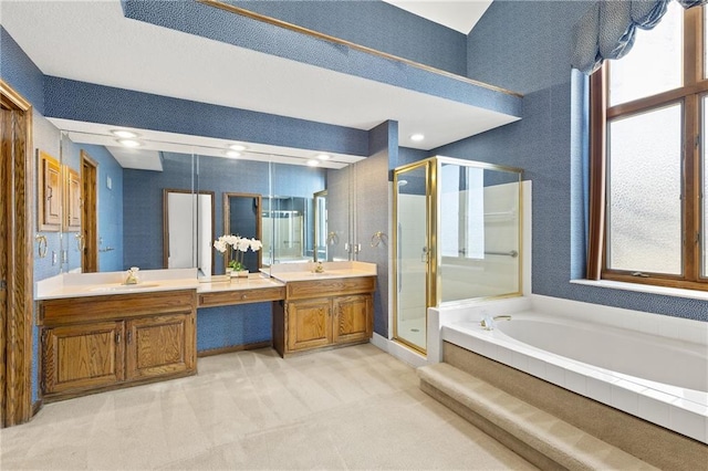 bathroom featuring vanity and shower with separate bathtub