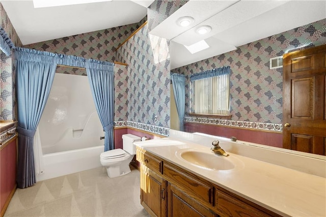 full bathroom featuring shower / bath combo, toilet, vanity, and a skylight