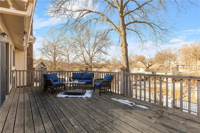 wooden deck with an outdoor living space