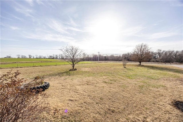 view of yard with a rural view