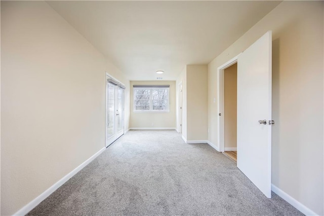 empty room featuring light colored carpet