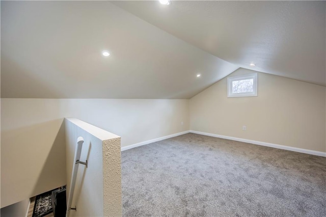 bonus room with carpet and lofted ceiling