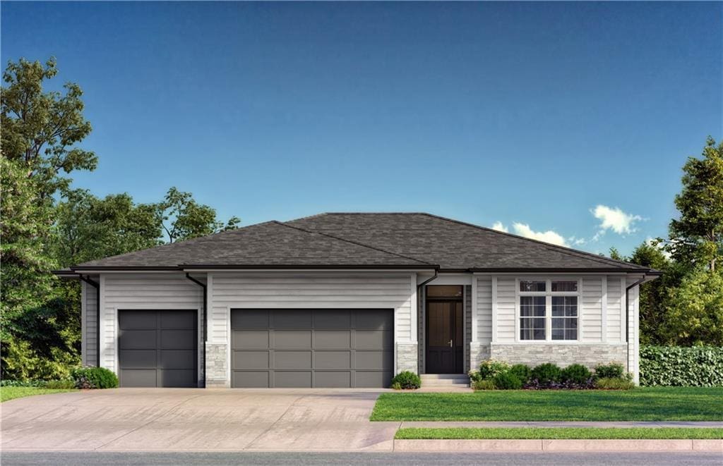 view of front facade featuring a garage and a front lawn