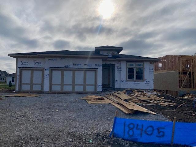 18405 Caenen St, Overland Park, KS 66013 - unfinished property with an attached garage