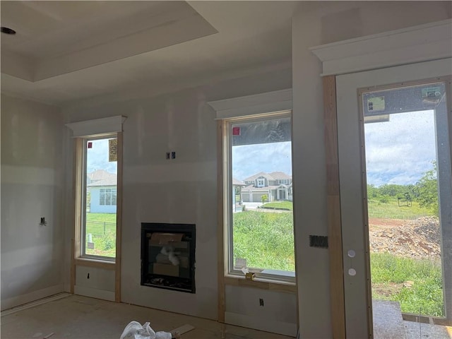 18405 Caenen St, Overland Park, KS 66013 - unfurnished living room with a glass covered fireplace