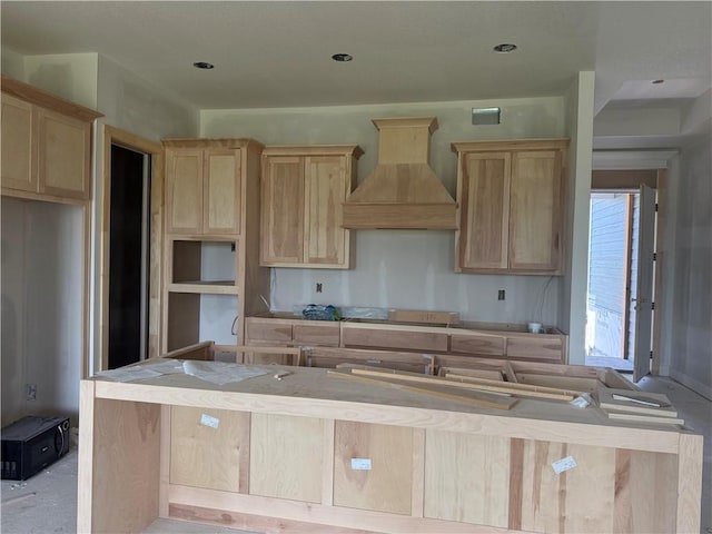 18405 Caenen St, Overland Park, KS 66013 - kitchen featuring premium range hood, light brown cabinetry, and a kitchen island