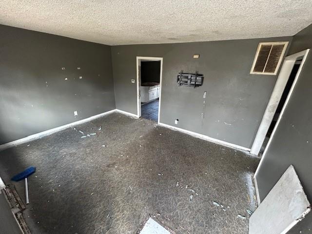 interior space featuring a textured ceiling