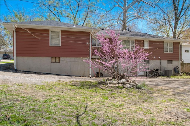 back of property featuring cooling unit