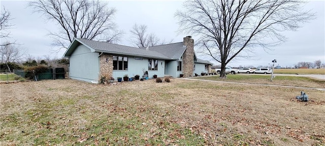 ranch-style house with a front lawn