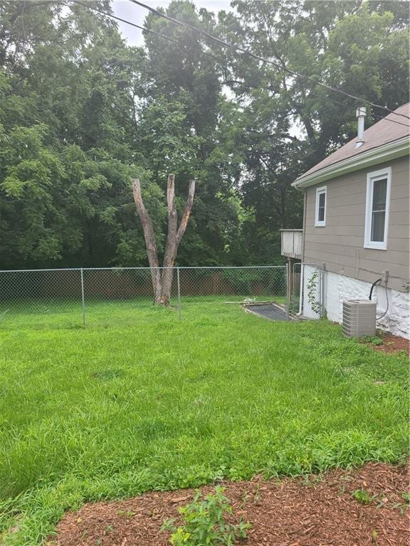 view of yard with central air condition unit