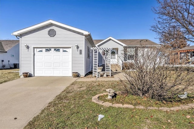 ranch-style home with a garage and a front yard