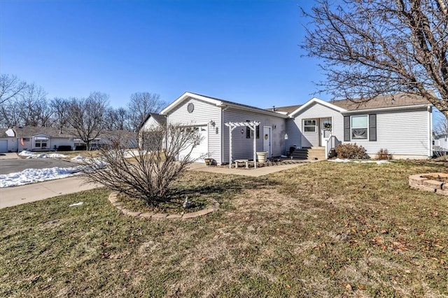 single story home with a garage and a front lawn