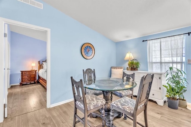 dining area with light wood-type flooring