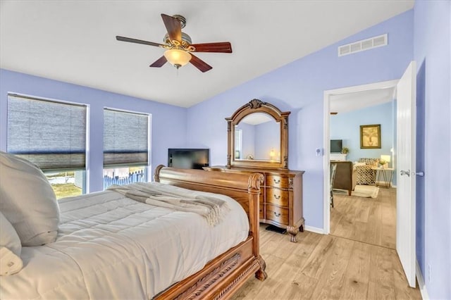 bedroom with light hardwood / wood-style floors and ceiling fan