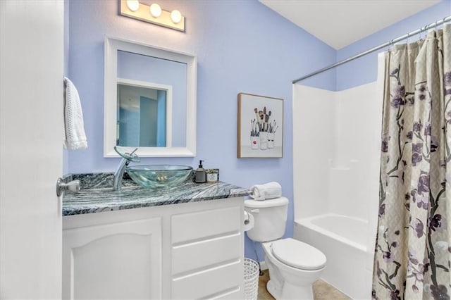 full bathroom with vanity, toilet, and shower / bath combo with shower curtain