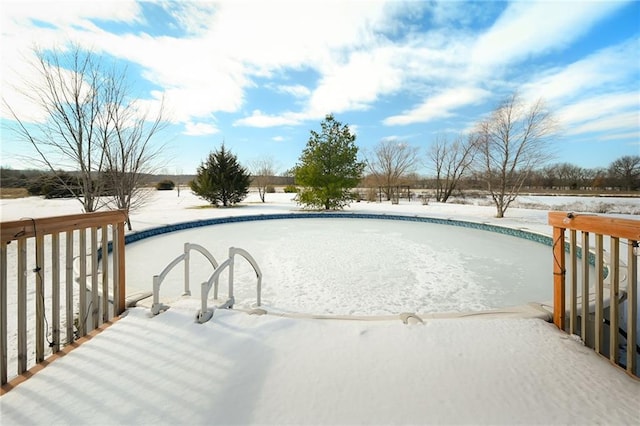 view of snow covered pool