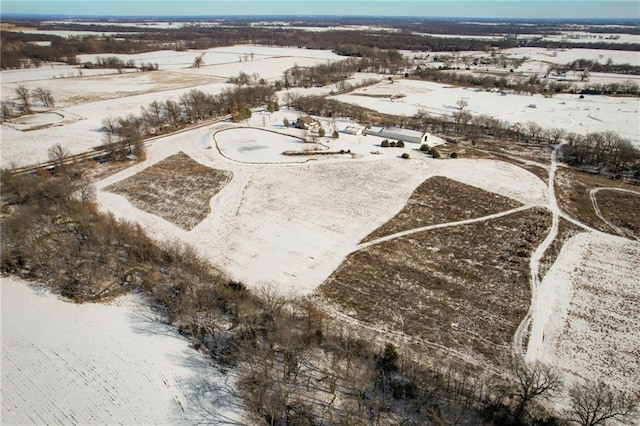 snowy aerial view with a rural view