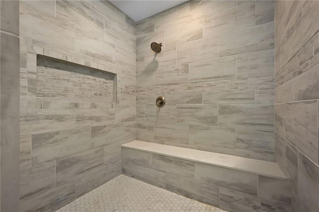 bathroom with tiled shower