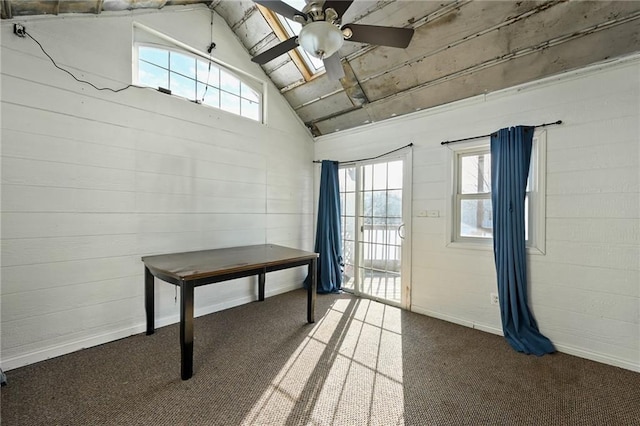 basement with dark carpet and ceiling fan