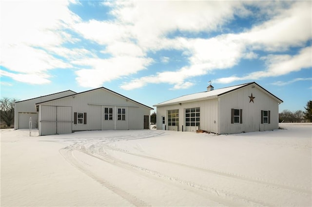 back of house with a garage