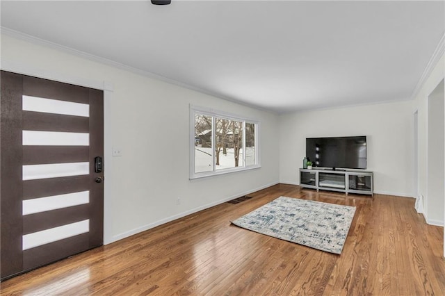 interior space with crown molding and hardwood / wood-style floors