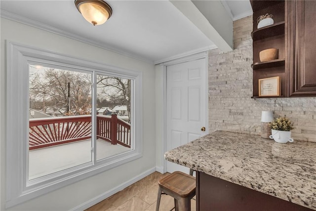 dining area with ornamental molding